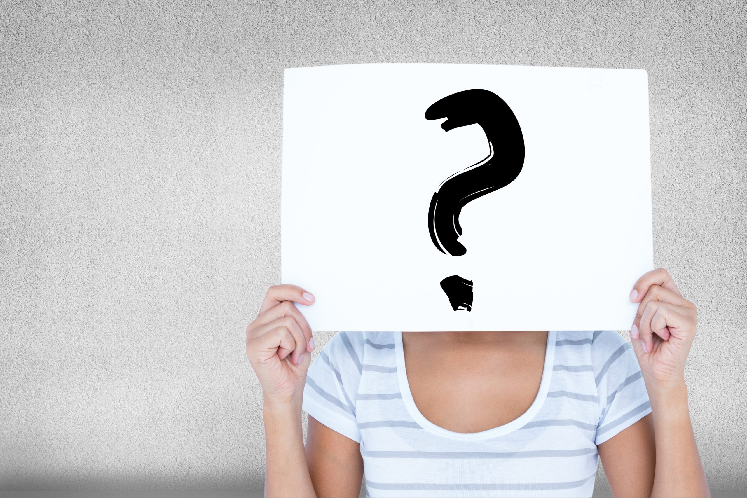 woman-with-sign-in-the-face-with-question-mark